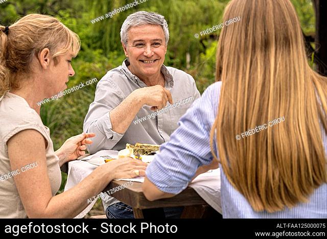 Family having lunch in garden