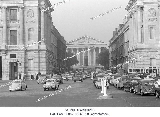 Traffic - France in 1960. Traffic in Paris, VW Käfer on the Rue Royale and a view to the Madeleine church ( Eglise de la Madeleine )