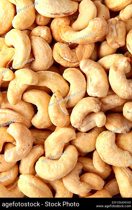 Cashew nuts, without shells, in large quantities. Natural product. The view from the top. Copy space.Full frame