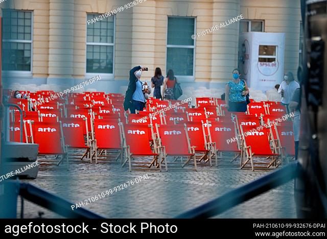 09 June 2021, Berlin: Chairs stand in front of the screen at the premiere of the film ""Me and the Others"" at Charlottenburg Palace