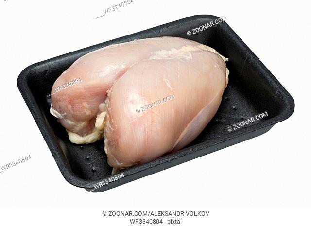 Fresh raw chicken breast with bones in the standard plastic black container. Isolated with patch