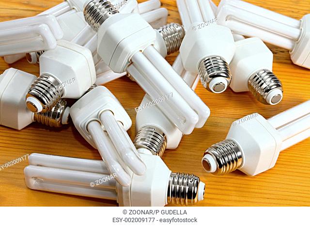 Many fluorescent lightbulbs in a pile