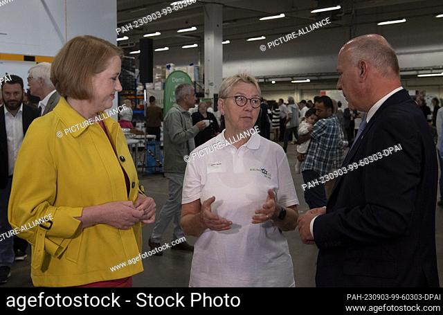 03 September 2023, Berlin: Chairwoman and founder of the Berliner Tafel Sabine Werth (Mi) speaks with Governing Mayor Kai Wegner (CDU) and Federal Minister for...