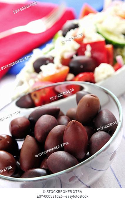 Black kalamata olives and Greek salad with feta cheese