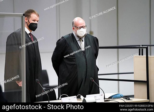 01 February 2022, Schleswig-Holstein, Itzehoe: Niklas Weber (l) and Wolf Molkentin, lawyers for the defendants, stand in the courtroom at the beginning of the...