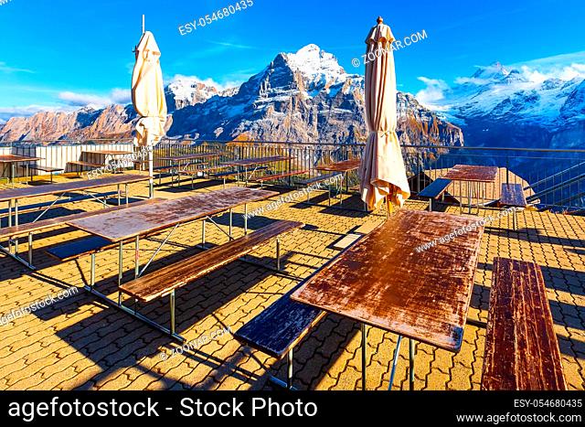 Grindelwald, Switzerland, Jungfraujoch panorama, bar terrace at First peak of Swiss Alps mountain, snow peaks panorama, Bernese Oberland, Europe