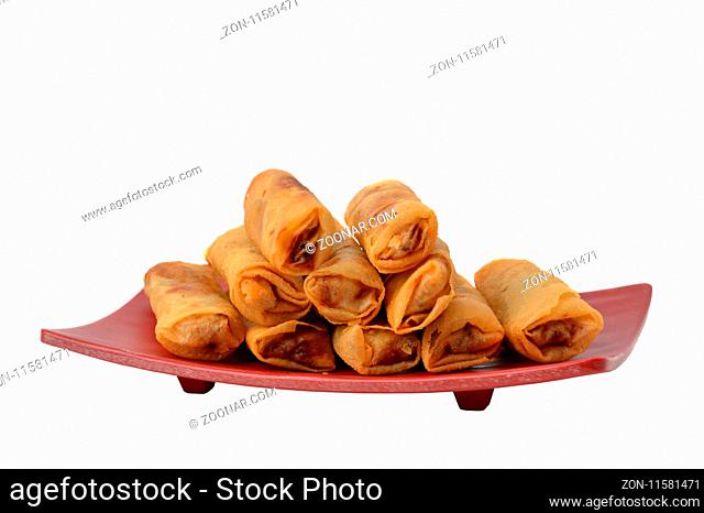 lumpia Semarang or Spring Rolls containing bamboo shoots and chicken on red plate at white background