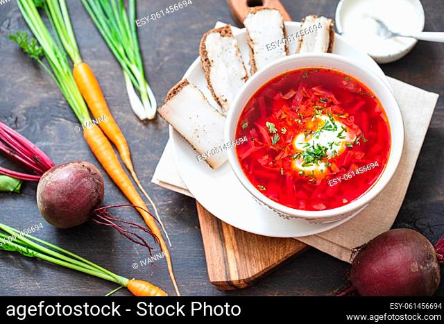 Ukrainian red national dish borsch, beet soup, added to Unesco list. Borscht with sour cream. Beetroot borscht with parsley