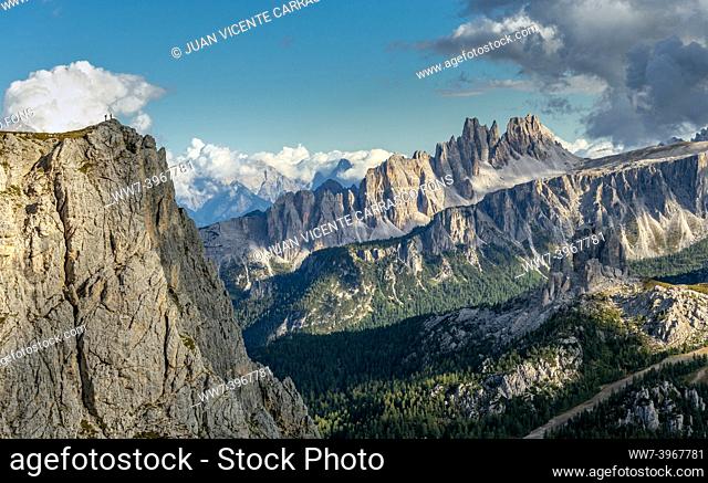 Hikers on a cliff, Veneto, Dolomites, Italian Alps