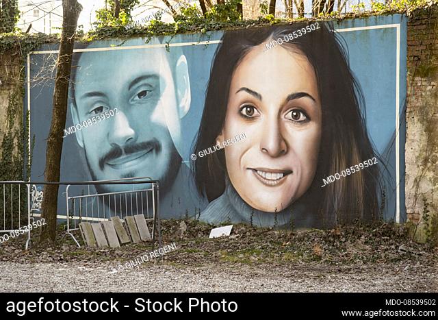 The mural with the smiling faces of the two researchers Giulio Regeni and Valeria Solesin created by the artists Rosk & Loste in the Aldrovaldi Garden (now...