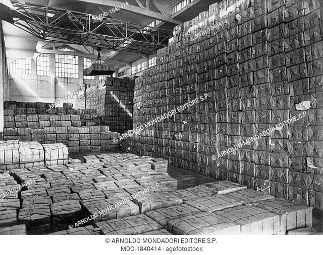 Some packs of cellulose cases stocked in a storage room of one of the SNIA Viscosa factories producing rayon and staple yarns. Pavia, 1920s