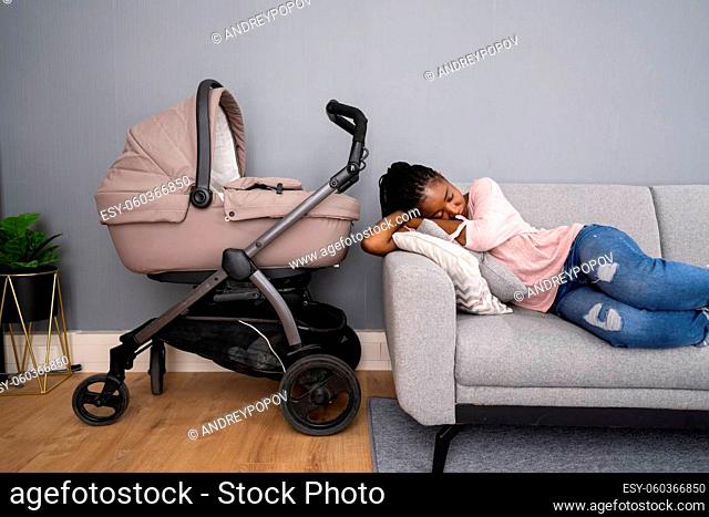Depressed Unhappy African American Woman With Newborn. Frustrated Mum
