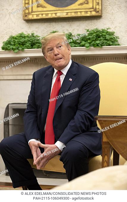United States President Donald Trump listens to a reporter ask a question as he meets with The President of Portugal Marcelo Rebelo de Sousa in the Oval Office...