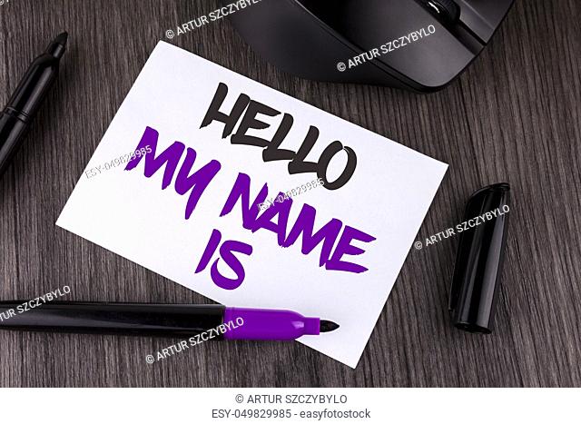 Handwriting text writing Hello My Name Is. Concept meaning meeting someone new Introduction Interview Presentation written white Sticky Note Paper the wooden...