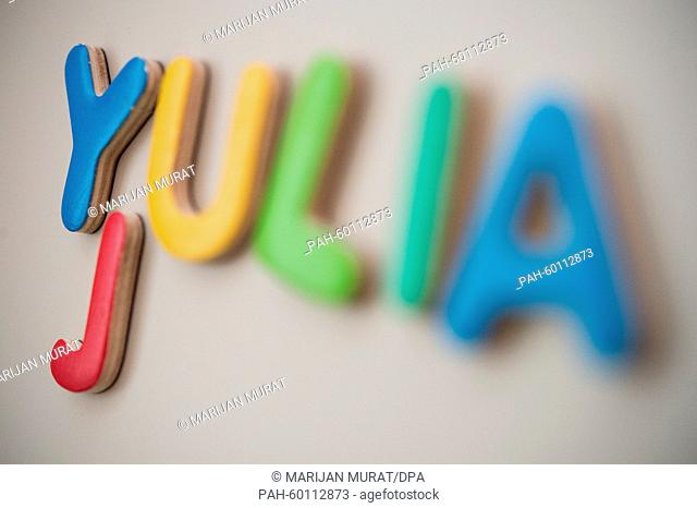 ILLUSTRATION - The first name Yulia spelt out of magnet letters are sticking to a metal wall in Stuttgart, Germany, 15 July 2015