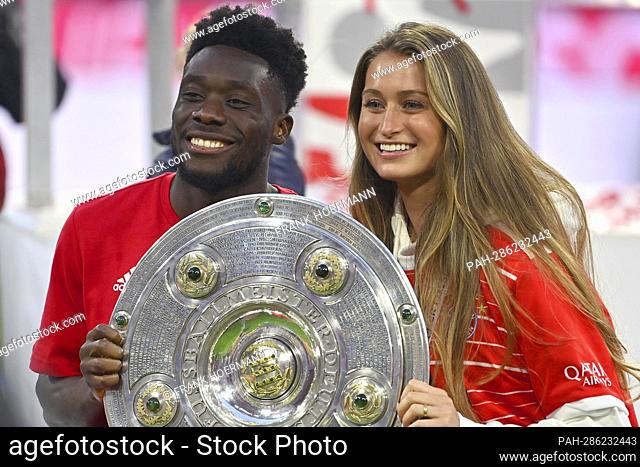 Alphonso DAVIES (FC Bayern Munich) with girlfriend Jordyn Huitema after award ceremony with bowl, championship bowl, cup, trophy