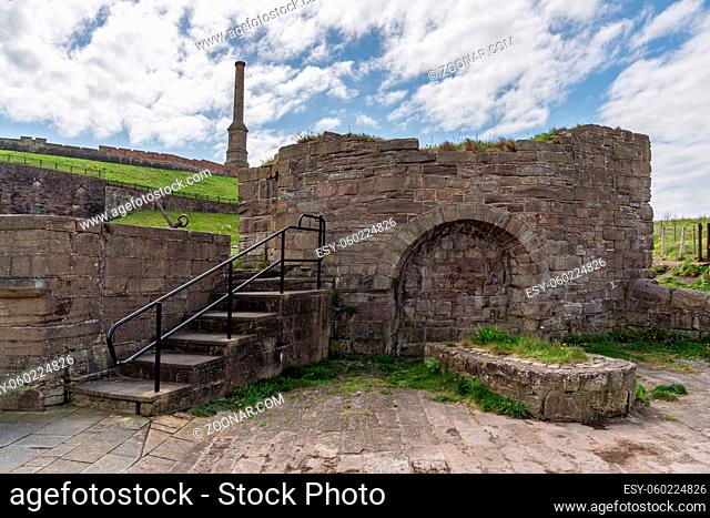 Old ruin with the Candlestick Chimney in the background, seen in Whitehaven, Cumbria, England, UK