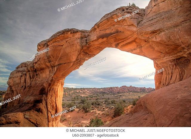 Erosion over millions of years has produced sandstone arches like Broken Arch at Arches National Park, Utah