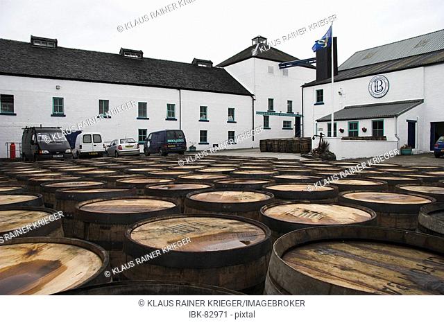 Used casks laying in the yard of Bruichladdich distillery, get recycled and filled again. Isle of Islay, Scotland