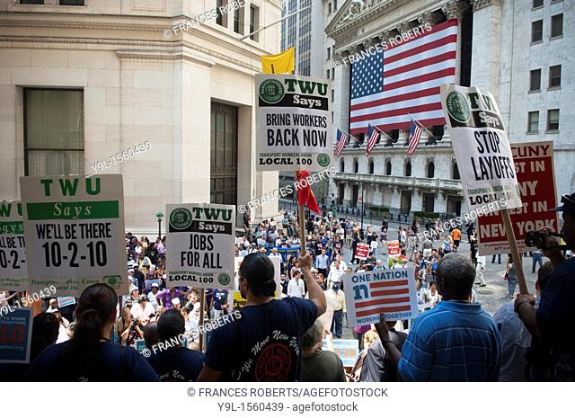 Union members and supporters rally against unemployment in front of Federal Hall, across the street from the New York Stock Exchange in New York
