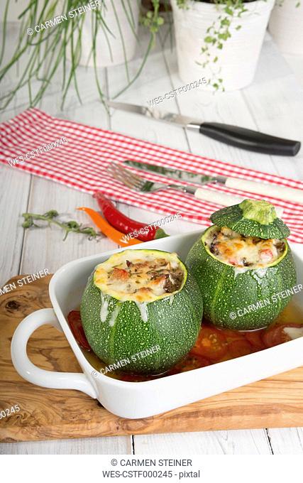Baked filled eight ball squashes with ground beef in a gratin dish, Low Carb