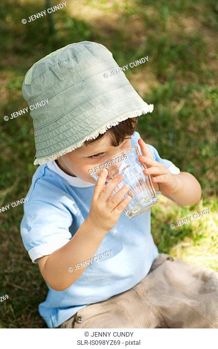 Boy drinking glass of water