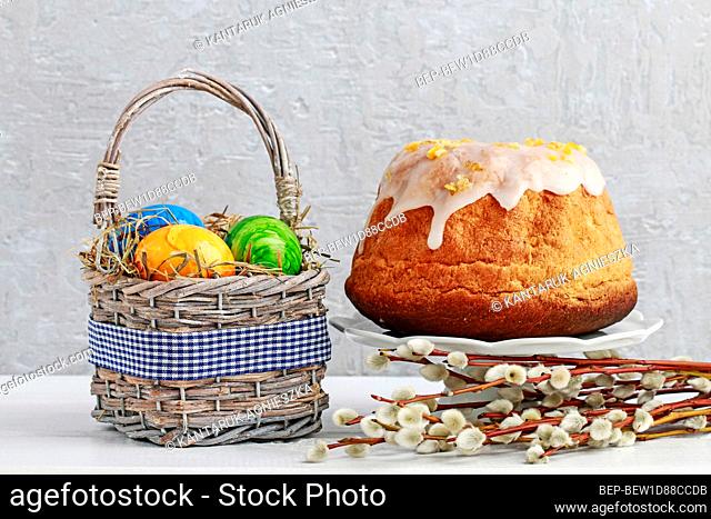 Basket with Easter eggs and traditional cake. Festive time