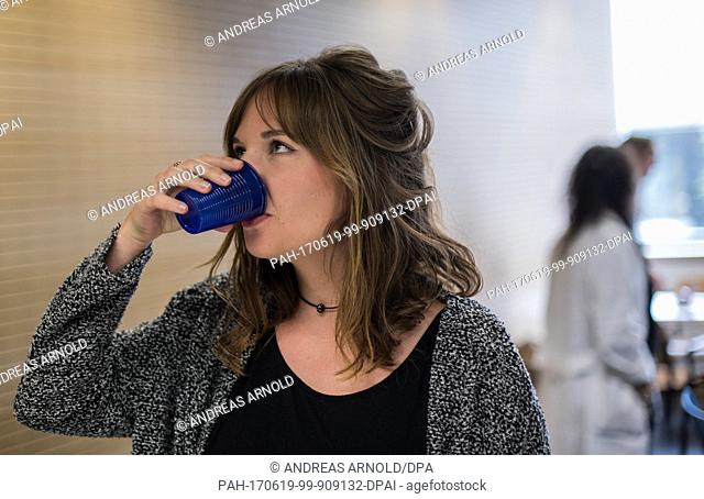 Subject Madeleine drinks an anti-hangover remedy in Mainz, Germany, 16 June 2017. The University of Mainz examines the effectivicty of an anti-hangover remedy...