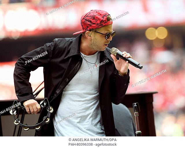 US-pop band One Republic with singer Ryan Tedder perform on stage during the half time break in the Bundesliga soccer match between Bayern Munich vs Hannover 96...