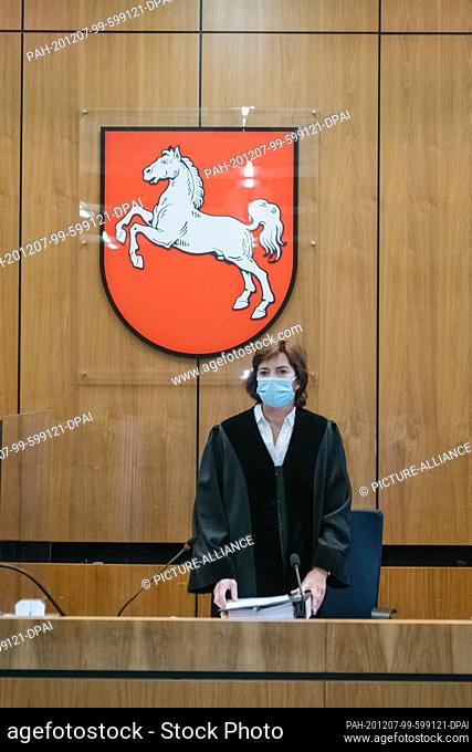 07 December 2020, Lower Saxony, Hildesheim: The presiding judge at the Hildesheim Regional Court, Barbara Heidner, is standing with mouth and nose protection in...