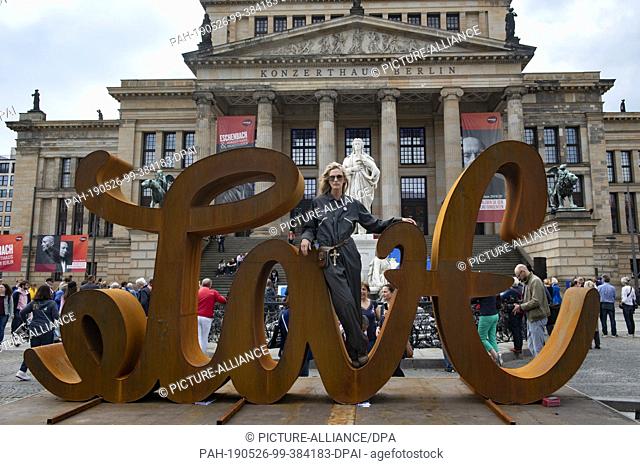 26 May 2019, Berlin: The artist Mia Florentine Weiss stands on her sculpture ""LOVE HATE"" at the Gendarmenmarkt. There, supporters of the European initiative...