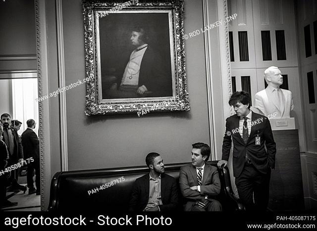 Senate staffers wait for their senators outside of the Senate Democrat policy luncheon in the Ohio Clock corridor, at the US Capitol in Washington, DC, Tuesday