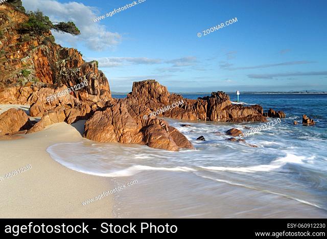 The ocean washing in around volcanic rocks at Shoal Bay, Australia. Lovely motion in the water