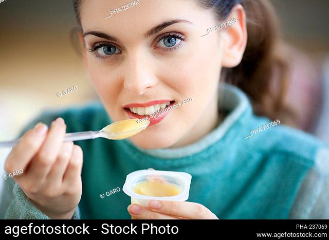 Woman eating compote