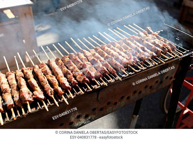 Grilled lamb skewers sizzling on barbecue, among the most popular street food in the world