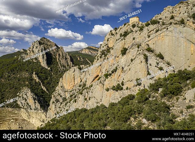 Hermitage of La Pertusa in front of the Montsec range and the Mont-rebei gorge, with the almost dry Canelles reservoir (La Noguera, Lleida, Catalonia, Spain