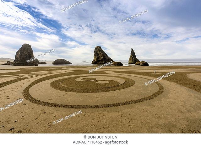 Sand labyrinth created by Labyrinth artist Denny Dyke at low tide on Bandon Beach, Bandon, Oregon, USA