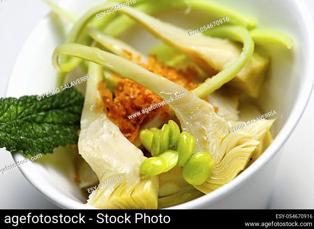 Brandade of cod with artichokes in a small white bowl