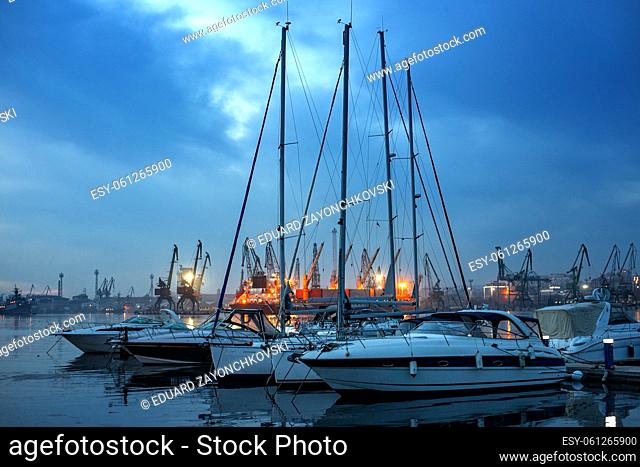 Yachts and boats after sunset in the harbor. Black sea, Varna, Bulgaria