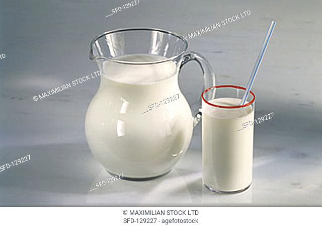Milk in a Pitcher and in a Glass with a Straw