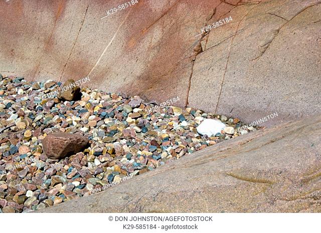 Rock outcrops and pebbles along shore of Lake Huron on George Island. Killarney. Ontario