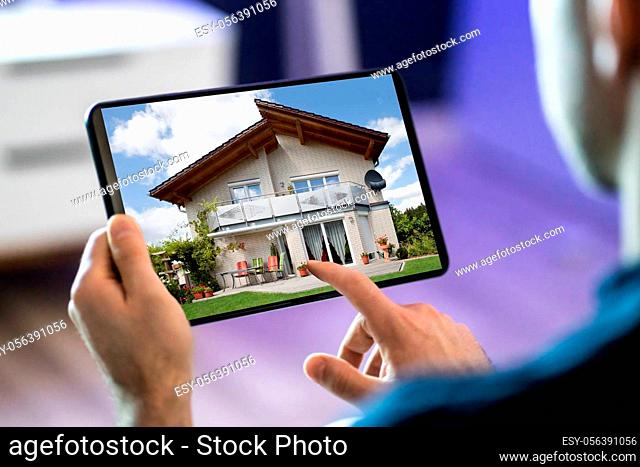 Online Real Estate Home Search On Tablet Computer