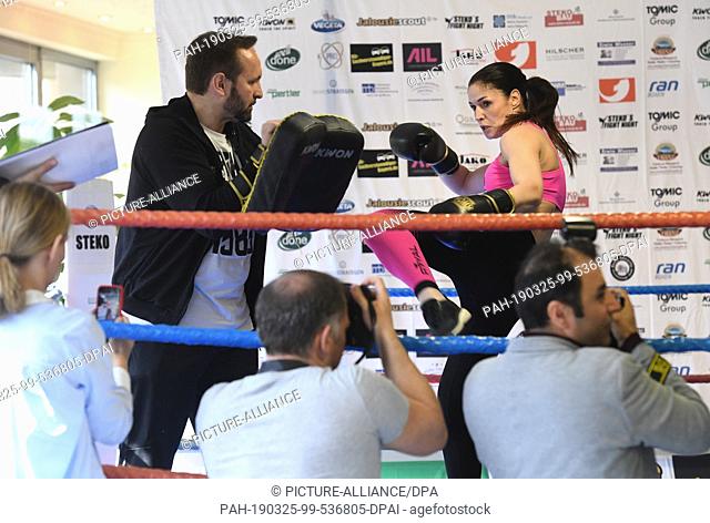25 March 2019, Bavaria, München: The kickboxing coach Pavlica Steko and the kickboxing world champion Marie Lang can be seen at the press training of Stekos...