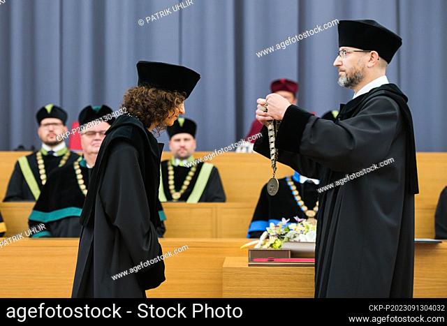 French Nobelist Emmanuelle Charpentier, co-author of ""genetic scissors"", left, receives an honorary doctorate from Mendel University Brno, on September 13