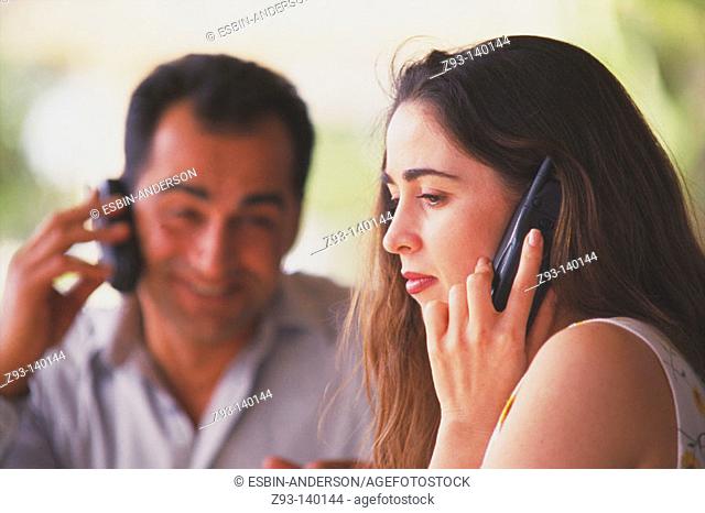 Couple talking on cell phones