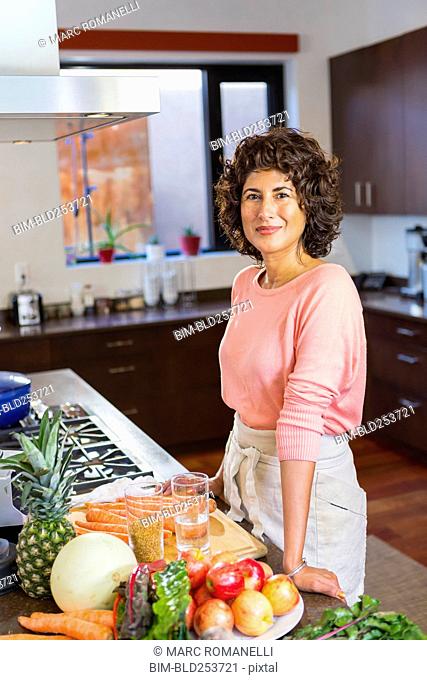 portrait of Hispanic woman in domestic kitchen