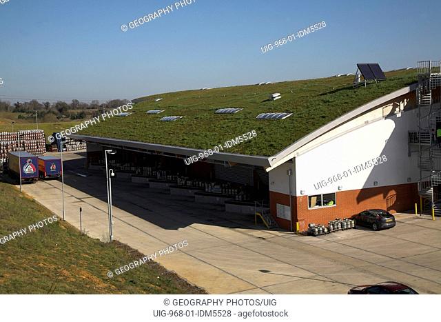 Sedum grass roofing and landscaped surroundings to blend in Adnams brewery distribution center in a rural location at Reydon, near Southwold, Suffolk, England