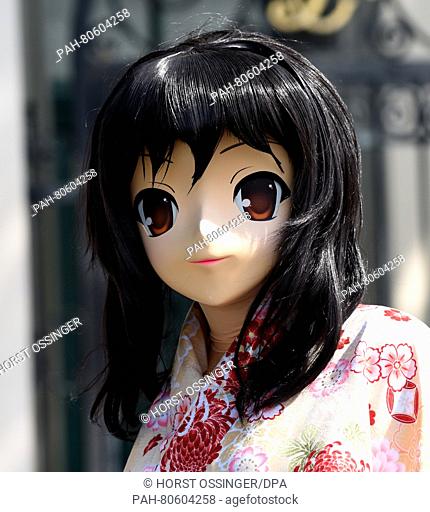 A woman dressed as a manga girl poses at the Japan Day in Duesseldorf, Germany, 21 May 2016. Thousands of enthusiasts attended the Japan Day