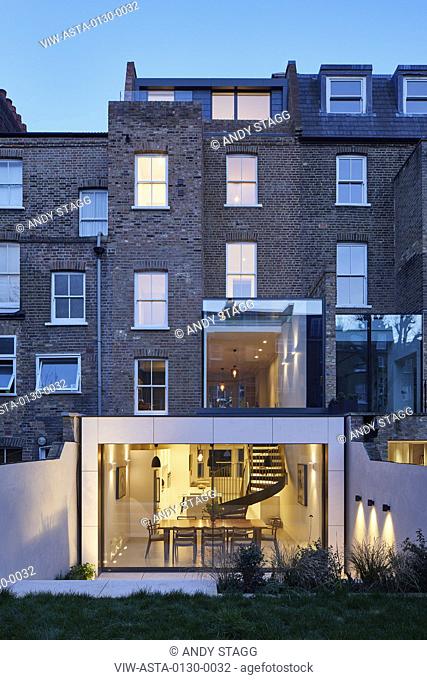 Overall view from garden with new glazed extension at dusk. Aynhoe House, London, United Kingdom. Architect: Paul Archer Design - Architects & Design, 2018