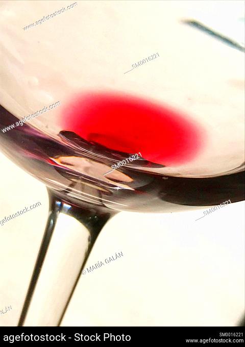 Rest of red wine in a glass. Close view